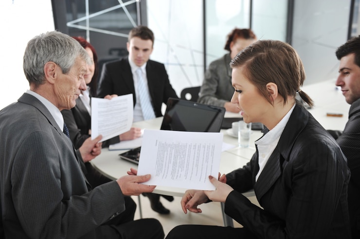 A sale and purchase contract beside a set of keys