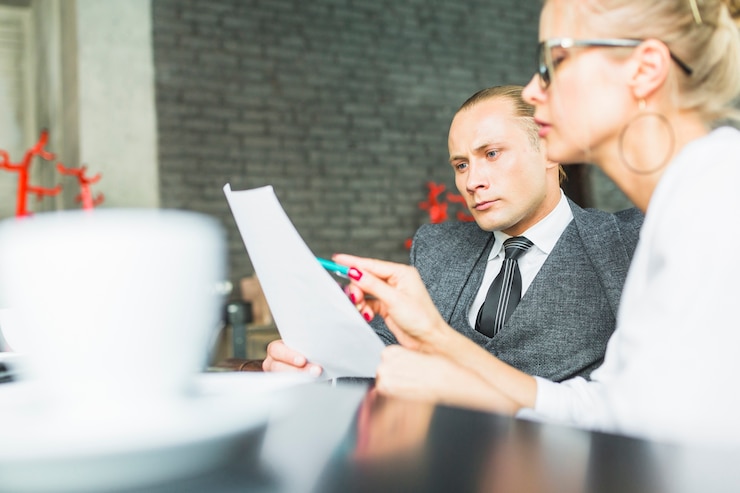 Reviewing a lease agreement at a desk